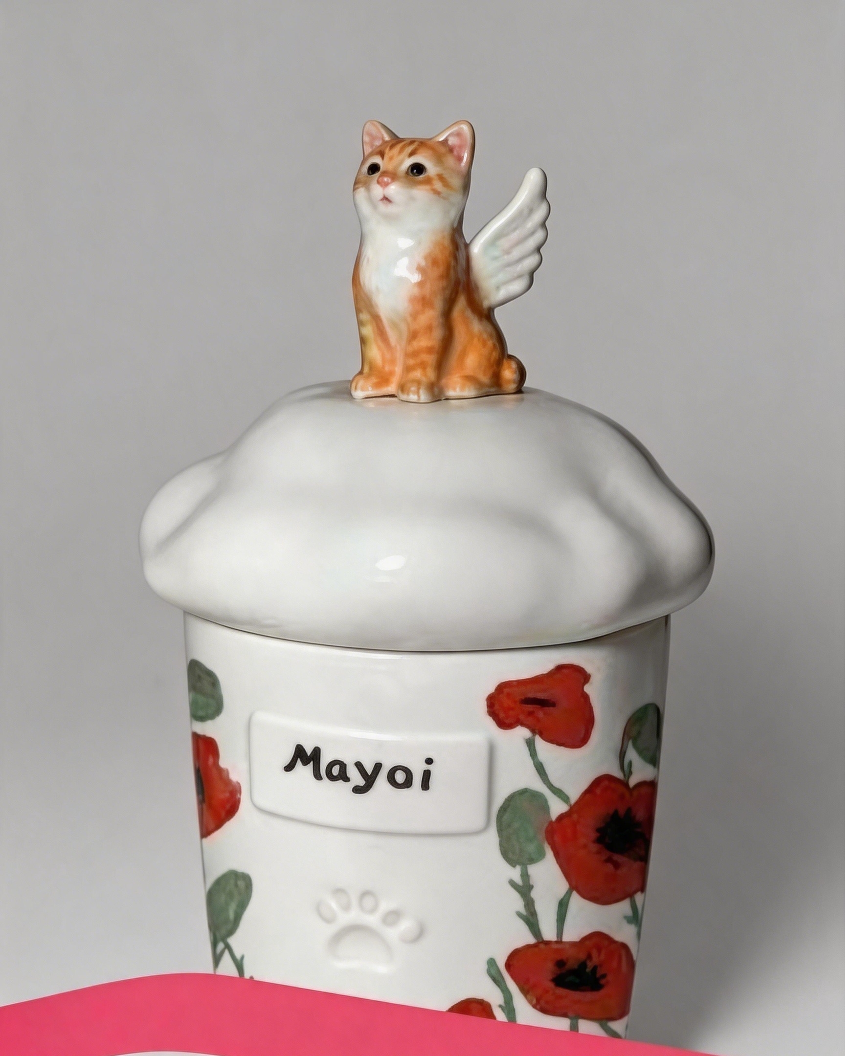 Hand-painted angel pet urns with floral detailing